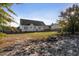 House exterior and backyard with fire pit and swing set at 96 Abram Ct, Broadway, NC 27505