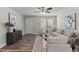 Living room with neutral furniture, hardwood floors, and ceiling fan at 96 Abram Ct, Broadway, NC 27505