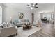 Spacious living room with hardwood floors, neutral furniture, and access to dining area at 96 Abram Ct, Broadway, NC 27505