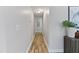 Long hallway with light walls and wood-look flooring at 96 Abram Ct, Broadway, NC 27505