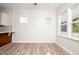 Bright breakfast nook with an accent wall and wood flooring at 831 Ridgeway Ave, Durham, NC 27701