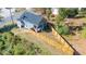 Aerial view of a house with a fenced triangular backyard at 831 Ridgeway Ave, Durham, NC 27701
