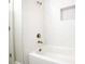 Bathroom with white tile and a modern bathtub at 831 Ridgeway Ave, Durham, NC 27701