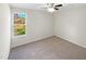 Bright bedroom with carpeted floor and a window offering natural light at 1122 E Ellerbee St, Durham, NC 27704