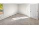 Spacious bedroom with window and carpeted floor at 1122 E Ellerbee St, Durham, NC 27704