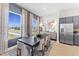 Elegant dining area with a large table and stunning window views at 1510 Village Hall Ln # 44, Wake Forest, NC 27587