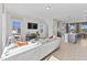 Open concept living room and kitchen with hardwood floors and lots of natural light at 1510 Village Hall Ln # 44, Wake Forest, NC 27587