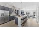 Open concept kitchen boasts stainless steel appliances and an island at 1510 Village Hall Ln # 44, Wake Forest, NC 27587