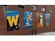 Colorful community mural depicting various scenes on a brick wall at 1510 Village Hall Ln # 44, Wake Forest, NC 27587