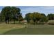 Golf course green with pond and trees in background at 1510 Village Hall Ln # 44, Wake Forest, NC 27587