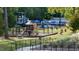 Community playground with slides, climbing structures, and pool at 1510 Village Hall Ln # 44, Wake Forest, NC 27587