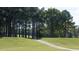 Pathway through a lush, tree-lined golf course at 1510 Village Hall Ln # 44, Wake Forest, NC 27587