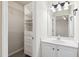 Bathroom features a vanity, shelves and a walk-in closet at 2129 Ventana Ln, Raleigh, NC 27604