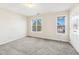 Upstairs bedroom with carpet and two windows at 2129 Ventana Ln, Raleigh, NC 27604