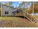 Spacious backyard with a large deck, screened porch, and lush lawn at 908 Royal Oaks Dr, Durham, NC 27712