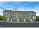 Three story townhomes with gray siding and white accents at 2213 Pitchfork Ln, Durham, NC 27713