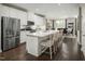 Spacious kitchen with island, stainless steel appliances, and white cabinetry at 2215 Pitchfork Ln, Durham, NC 27713