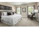 Spacious main bedroom with king-size bed and sitting area at 2215 Pitchfork Ln, Durham, NC 27713