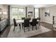 Elegant dining room with a large table and hardwood floors at 2215 Pitchfork Ln, Durham, NC 27713