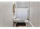 Clean bathroom featuring a bathtub, sink, and toilet at 915 Blount St, Smithfield, NC 27577