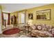 Bright basement area with floral couch and a view of the staircase at 1203 Lotus Lilly Dr, Durham, NC 27713