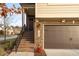 Side view of tan and brown brick townhome at 1203 Lotus Lilly Dr, Durham, NC 27713