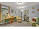 Home office with wood desk, comfortable chair, and built-in shelving at 1203 Lotus Lilly Dr, Durham, NC 27713