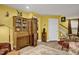 Charming basement sitting area, featuring a wooden secretary and room divider at 1203 Lotus Lilly Dr, Durham, NC 27713