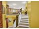 Elegant staircase leading to an upper level, with a view of the kitchen at 1203 Lotus Lilly Dr, Durham, NC 27713