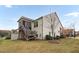 Two-story house with a deck and landscaped yard at 1203 Lotus Lilly Dr, Durham, NC 27713