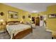 Spacious bedroom with large bed, sitting area and ample closet space at 1203 Lotus Lilly Dr, Durham, NC 27713