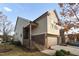 Side view of tan and brown brick townhome at 1203 Lotus Lilly Dr, Durham, NC 27713