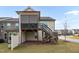 Two-story house with deck, stairs, and fenced yard at 1203 Lotus Lilly Dr, Durham, NC 27713