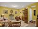 Cozy basement sitting area with wooden furniture and yellow walls at 1203 Lotus Lilly Dr, Durham, NC 27713