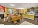Modern kitchen with dark cabinets, granite countertops and breakfast bar at 1203 Lotus Lilly Dr, Durham, NC 27713