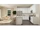 Modern kitchen with white cabinets, an island, and stainless steel appliances at 0 Hanover Dr, Sanford, NC 27330