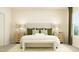 Spacious bedroom with a beige upholstered bed and wood nightstands at 0 Hanover Dr, Sanford, NC 27330