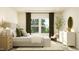 Primary bedroom with a large bed, dresser, and plenty of natural light at 0 Hanover Dr, Sanford, NC 27330