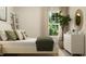 Bedroom featuring a white bed frame, green bedding, and a dresser at 0 Hanover Dr, Sanford, NC 27330