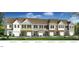 Elevation rendering of townhouses with attached garages and landscaping at 687 Leland Hl Cir, Zebulon, NC 27597