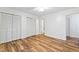 Well-lit bedroom with wood-look floors and ample closet space at 1321 Dylan Heath Ct, Raleigh, NC 27608