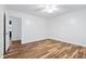 Bright bedroom with wood-look floors and access to bathroom at 1321 Dylan Heath Ct, Raleigh, NC 27608