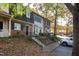 Townhouse with a tree-lined street and parking spaces at 1321 Dylan Heath Ct, Raleigh, NC 27608