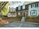 Brick townhouse with a charming front entrance and landscaping at 1321 Dylan Heath Ct, Raleigh, NC 27608