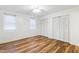 Spacious bedroom featuring wood-look floors and large closet at 1321 Dylan Heath Ct, Raleigh, NC 27608