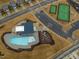 Aerial view of community pool, tennis courts, and playground at 1073 Channel Drop Lp, Zebulon, NC 27597