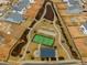 Aerial view showing community amenities including tennis court and a pond at 1073 Channel Drop Lp, Zebulon, NC 27597
