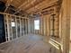 Framed bedroom with windows, showing OSB subflooring and electrical at 1073 Channel Drop Lp, Zebulon, NC 27597