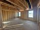 Framed bedroom with windows, showing OSB subflooring and electrical at 1073 Channel Drop Lp, Zebulon, NC 27597
