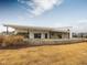 Modern clubhouse with stone accents and outdoor seating at 1073 Channel Drop Lp, Zebulon, NC 27597